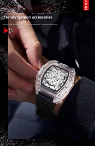 Close-up of tonneau transparent watch featuring hollow skeleton dial and silicone strap