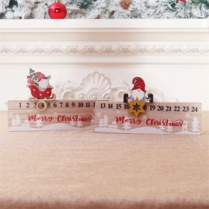 Macro detail of wooden Christmas advent calendar with Santa sliders on beige texture