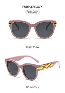 Detail of purple cat-eye sunglasses featuring golden diamond pattern metal on temples