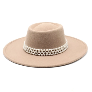 Macro view of khaki flat-top felt hat featuring elegant four-row pearl woven band detail