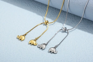 Adjustable snake bone necklaces in gold and silver featuring cute 3D elephant pendants