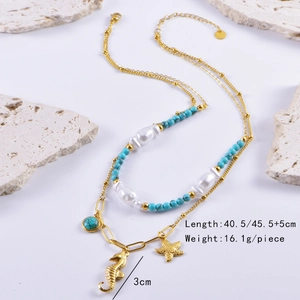 Detail showing gold seahorse and starfish charms with turquoise beads and white pearls