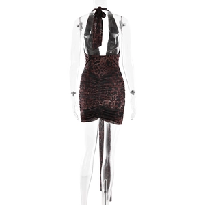 Detail of leopard print backless dress featuring slim-fit pleats and long decorative straps