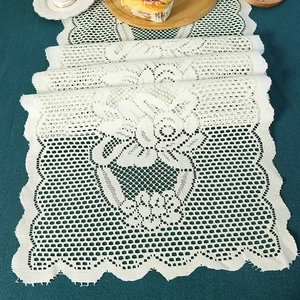 Elegant white lace table runner with hollow floral embroidery for holiday dining decor