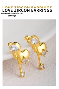 Macro shot of 18K gold plated heart earrings with white zircon inlays and fluid design