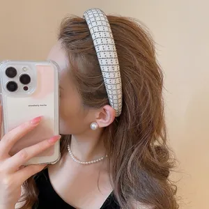 Elegant white mesh headband with silver rhinestones and pearls for a luxury hair accessory look