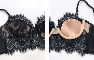 Close-up of black floral eyelash lace bra with nude cups and front buckle detail