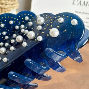 Navy blue cloud-shaped hair claw clip with white pearls and gold glitter accents