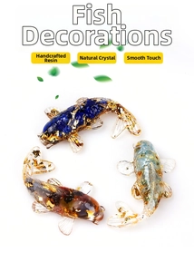 Close-up of three koi fish figurines made of natural crystal resin with gold foil flakes