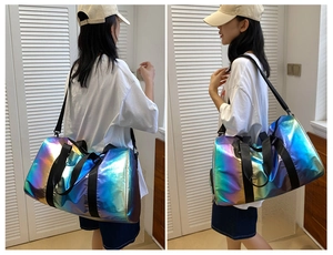 Luminous gradient holographic duffel bag showing side and back view on model with shoulder strap