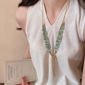 Ethnic layered long necklace with green crystal beads and delicate metal tassels
