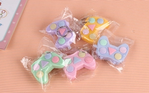 Mini gamepad sensory fidget toys in five colors with keychain attachment and bag packaging