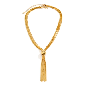 Detailed view of golden multi-layer chain necklace with large bead and fringe tassel