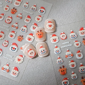 3D Christmas nail art stickers featuring Santa, reindeer and snowmen on nude base