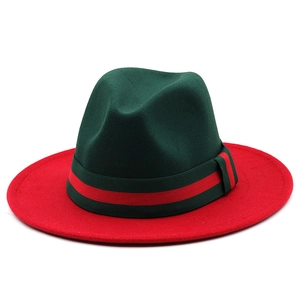 Classic fedora hat with green crown, red brim and striped ribbon on white background