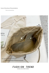 Detail view showing internal compartments of the quilted tote bag with zippered pockets