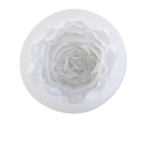 Top view of circular translucent silicone mold with intricate 3D peony flower details