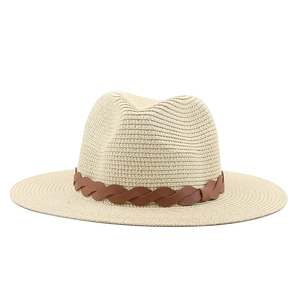 Detail of light beige straw fedora featuring a dark brown woven leather band decoration