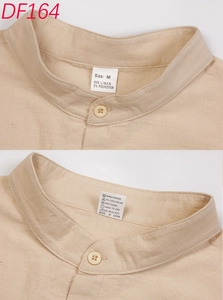 Detail of mandarin collar and fabric tag showing 95% linen composition and M size