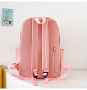 Pink school backpack back view showing adjustable straps and hidden anti-theft zipper pocket