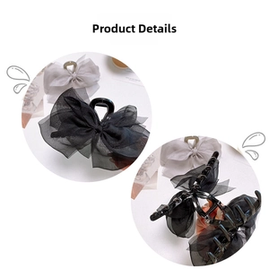Detail view of large mesh bow hair claw clips in black and grey with sturdy plastic teeth
