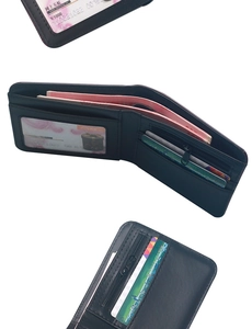 Detail view of the black matte leather wallet featuring multiple card slots and a zip pocket