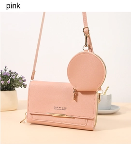 Detailed view of pink PU leather crossbody bag with a round coin purse and gold accents
