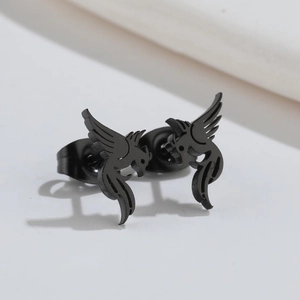 Detail view of matte black bird-shaped stud earrings with a cutout silhouette design