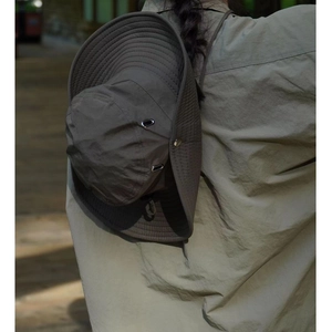 Outdoor olive green bucket hat with side snaps and adjustable drawstring for camping