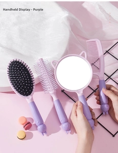 Purple hair care set including cushion brush and round cat ear mirror with relief details