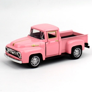 Detailed close-up of a pink vintage alloy Ford pickup truck model with silver accents