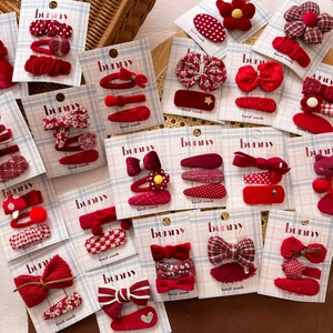 Handmade red fabric bow hair clip set for girls with classic patterns and floral details