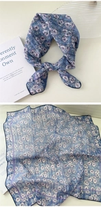 Detailed view of floral cotton linen scarf with blue and purple small flower patterns