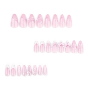 Pink French press-on nails with 3D bows, camellias, and pearls on white background