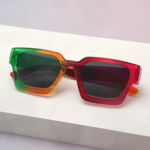 Detail of square thick frame sunglasses with green, orange and red gradient design