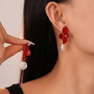 Vintage Ancora red flower earrings with freshwater pearl drops on model