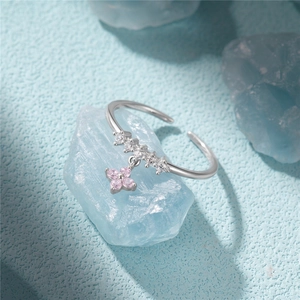 Macro detail of S925 silver adjustable ring featuring a pink heart petal flower pendant