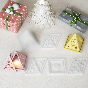 Detail of pyramid silicone molds for DIY resin candle holders with heart and star textures