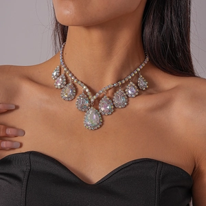 Close-up of luxury water drop pendant necklace with iridescent crystals on a model
