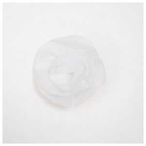 Macro detail of layered white chiffon rose brooch with delicate translucent petals