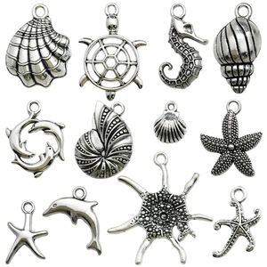 Collection of antique silver ocean theme alloy charms including starfish and seahorse
