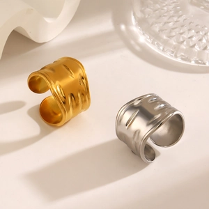 Wide hammered stainless steel open rings in gold and silver finish with textured surface
