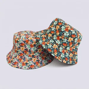Summer bucket hats with floral digital prints in pink and dark blue cotton canvas