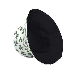 Reversible clover print bucket hat with green shamrocks on white and solid black interior