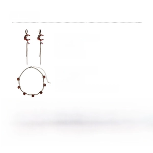 Detail view of moon earrings and resin necklace with material specifications and weight