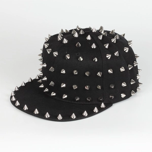 Detail of black snapback hat with silver punk metal spikes and adjustable flat brim
