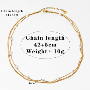 Detail of multi-layered gold snake chain necklace with pearl accents and adjustable length