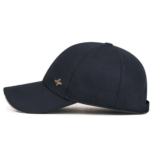 Classic navy blue sandwich baseball cap with gold metal side accent for men