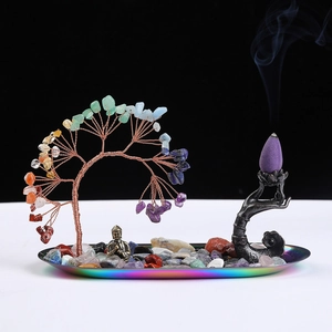Detailed view of Tree of Life and Buddha backflow incense burner with amethyst crystals