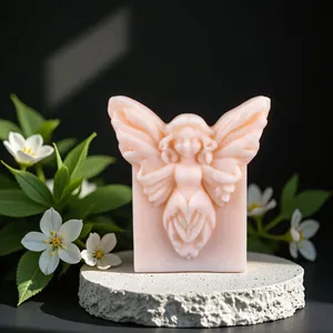 Detailed view of fairy shaped aroma stone on stone base with floral accents